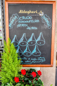 A chalkboard advertising the local prosciutto - Montagnana, Veneto, Italy - rossiwrites.com
