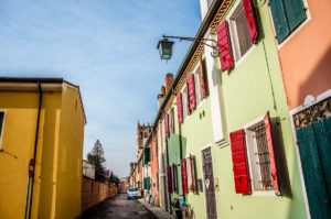 A row of colourful houses by the medieval wall - Montagnana, Veneto, Italy - rossiwrites.com