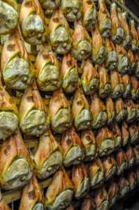 Rows of prosciutto hams being dry cured the traditional way - Montagnana, Veneto, Italy - rossiwrites.com