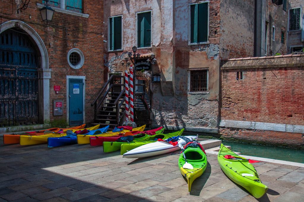Colourful canoes at Rialto Fish Market - Venice, Italy - rossiwrites.com
