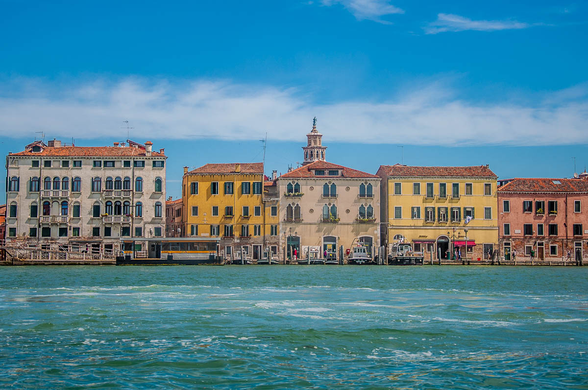 Colourful houses on the Fondamenta delle Zattere glimpsed from the window of the ferry - Venice, Italy - rossiwrites.com