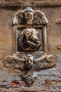 Decorative elements on the wall of a house in Dorsoduro - Venice, Italy - rossiwrites.com