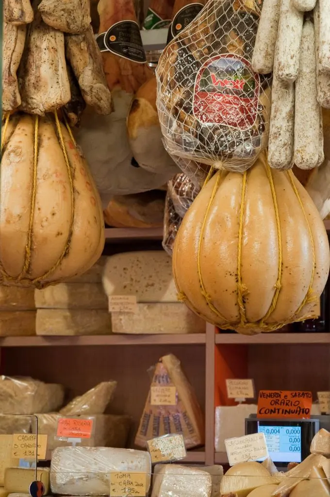 Cheeses and salumi in a shop on the ground floor of Palazzo della Raggione, Piazza delle Erbe, Padua, Italy - www.rossiwrites.com