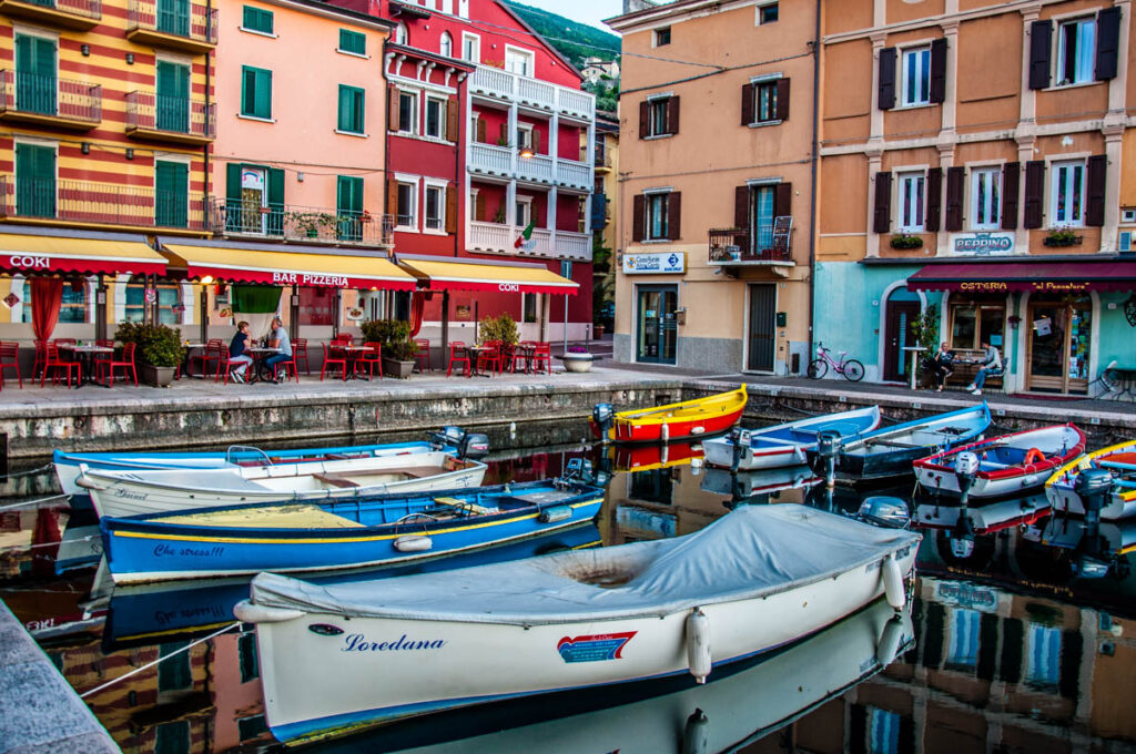 Colourful boats in the small harbour - Castelletto sul Garda, Veneto, Italy - rossiwrites.com