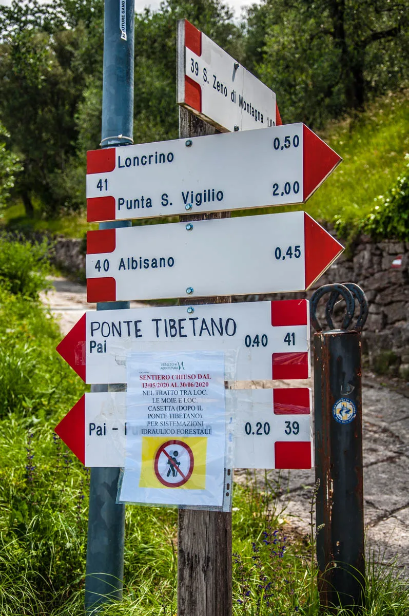 Signs pointing the way to different local hikes and walks - Crero, Lake Garda, Veneto, Italy - rossiwrites.com