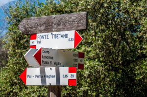 Signs pointing the way to local hikes and to the Tibetan bridge - Crero, Lake Garda, Veneto, Italy - rossiwrites.com