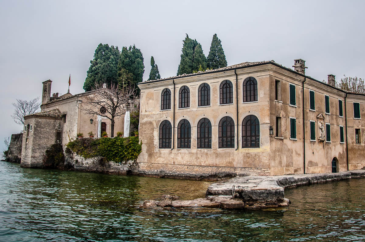 Locanda di San Vigilio and the church seen from the water - Punta di San Vigilio - Lake Garda, Italy - rossiwrites.com