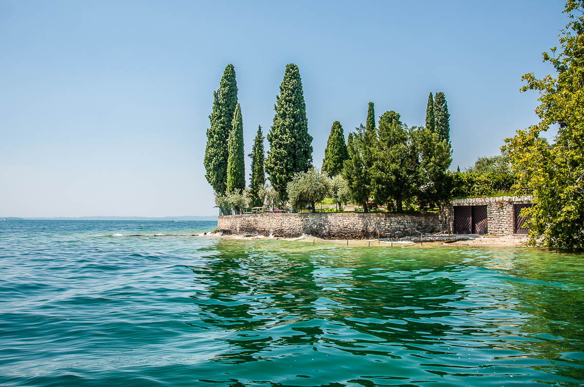 Parco di San Vigilio seen from the water - Lake Garda, Italy - rossiwrites.com