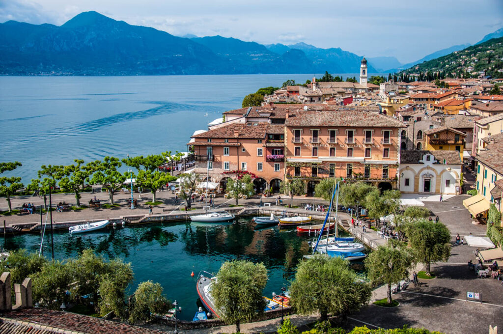 View of the historic harbour and the historic centre from the medieval Scaliger Castle - Torri del Benaco, Italy - rossiwrites.com