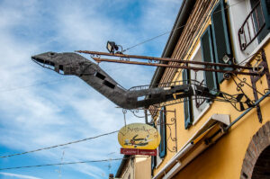 The signs of a restaurant specialising in eels - Comacchio, Italy - rossiwrites.com