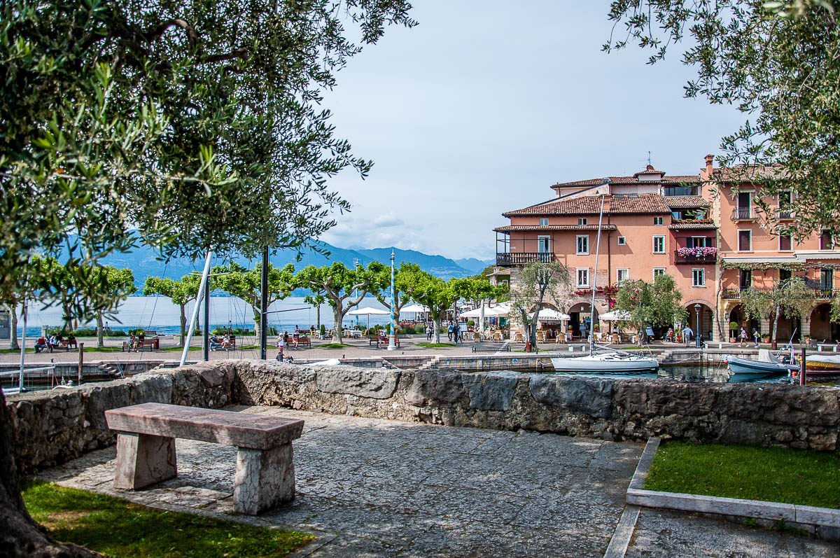 View of the historic harbour with Lake Garda - Torri del Benaco, Italy - rossiwrites.com