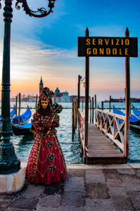 A beautiful Venetian mask standing in front of the island of San Giorgio Maggiore - Venice, Italy - rossiwrites.com