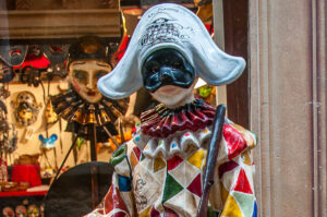 A real-size Arlecchino Mask in front of the Ca Macana shop - Venice, Italy - rossiwrites.com
