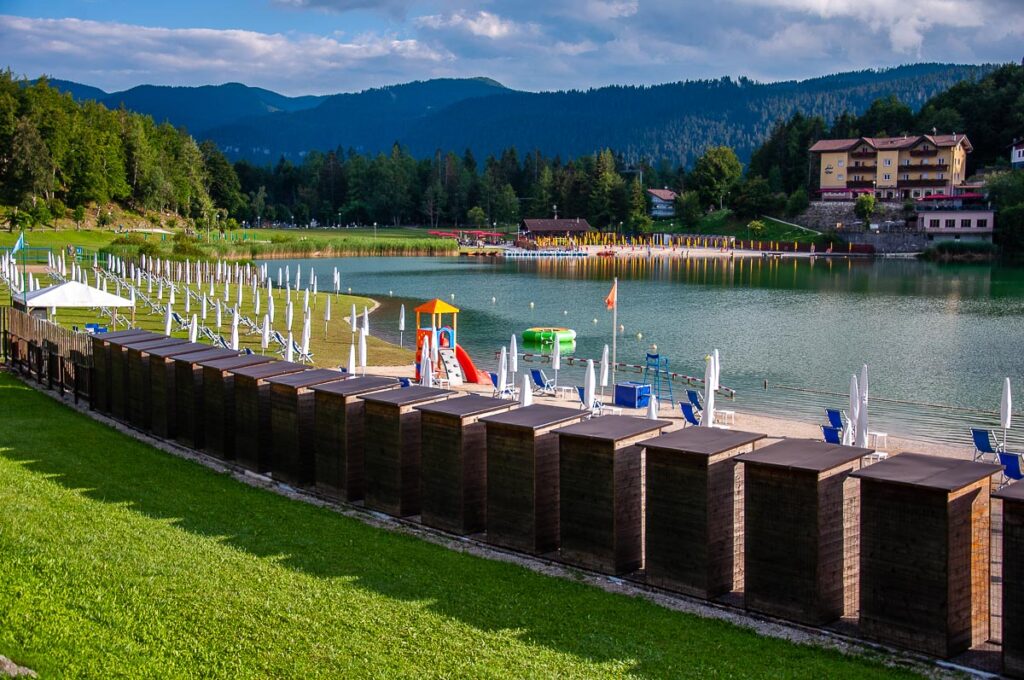 Beach huts lined along the beaches of Lake Lavarone - Trentino, Italy - rossiwrites.com