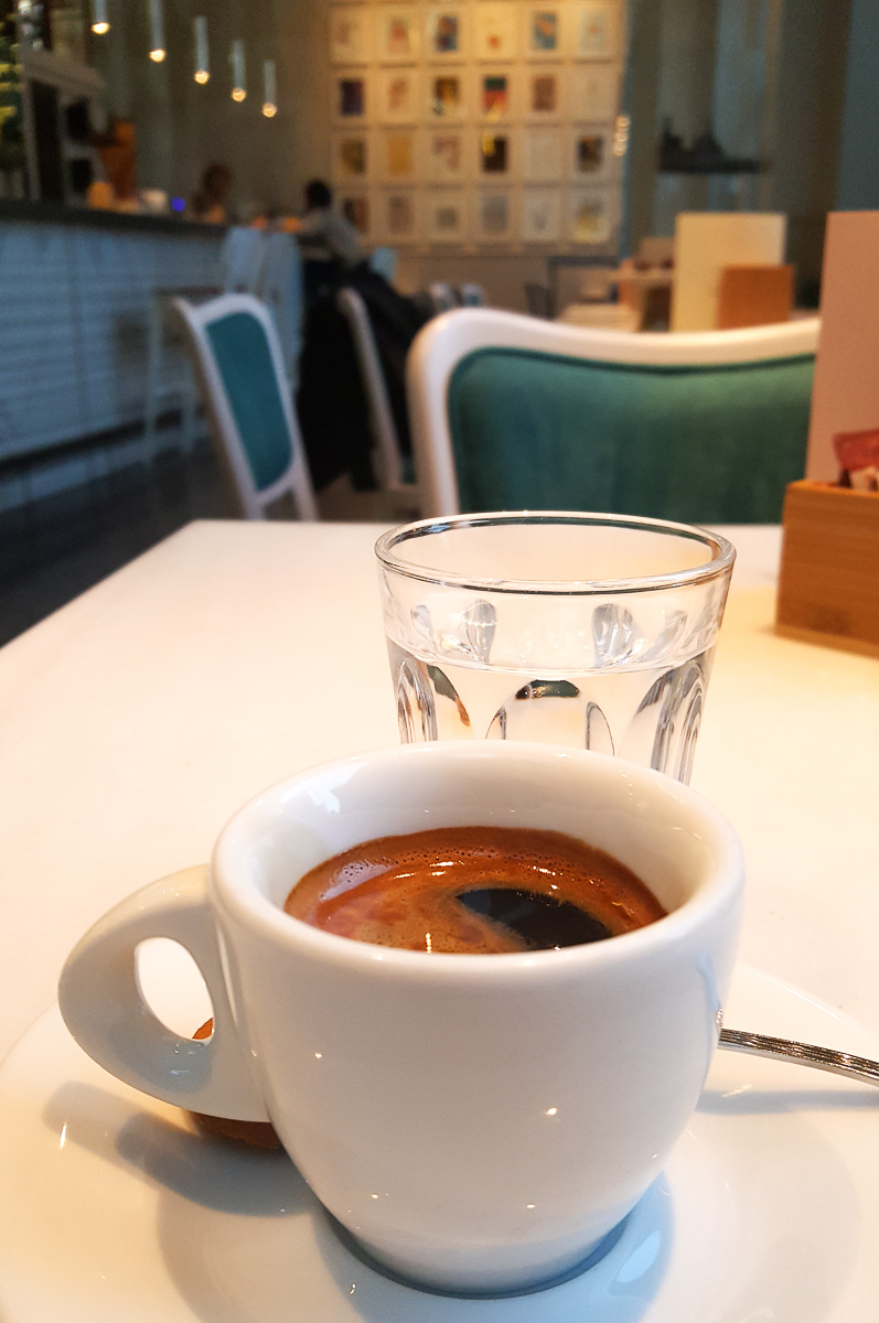 Espresso served with a glass of water - Vicenza, Italy - rossiwrites.com