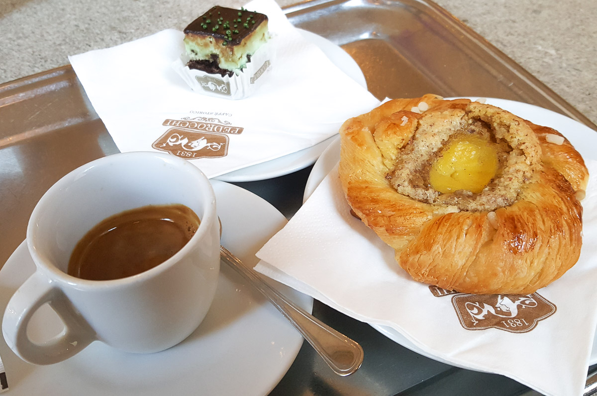 Espresso served with a pastry and a tiny Pedrocchi cake - Caffe Pedrocchi - Padua, Italy - rossiwrites.com