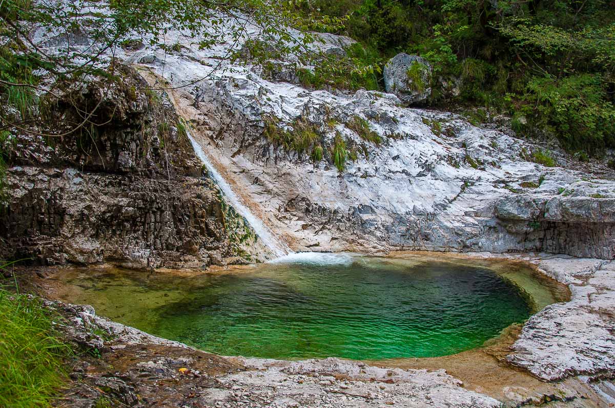 One of the 15 pools with the waterfal feeding it - Cadini del Brenton - Dolomites, Italy - rossiwrites.com