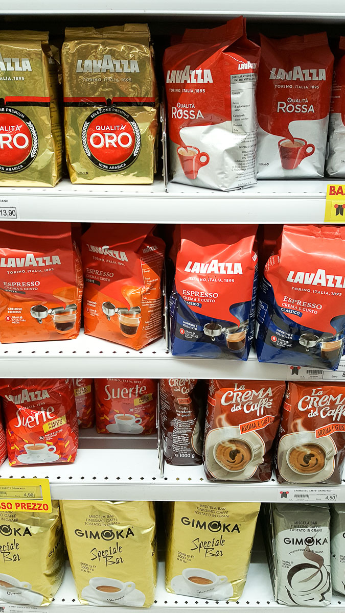 Shelves stocked with different types of coffee in an Italian supermarket - Vicenza, Italy - rossiwrites.com