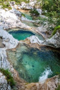 The pools seen from the wooden bridge - Cadini del Brenton - Dolomites, Italy - rossiwrites.com