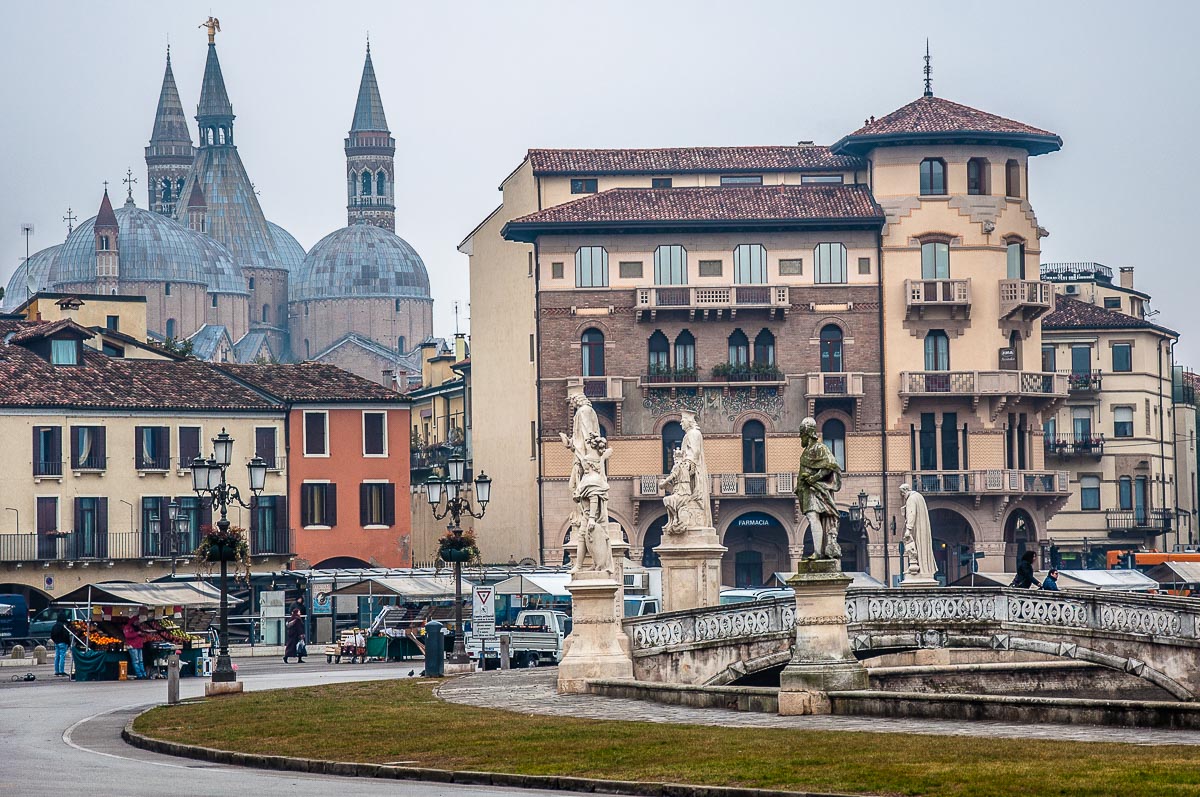 Prato della Valle with the daily market and the domes of the Basilica of St. Anthony - Padua, Italy - rossiwrites.com