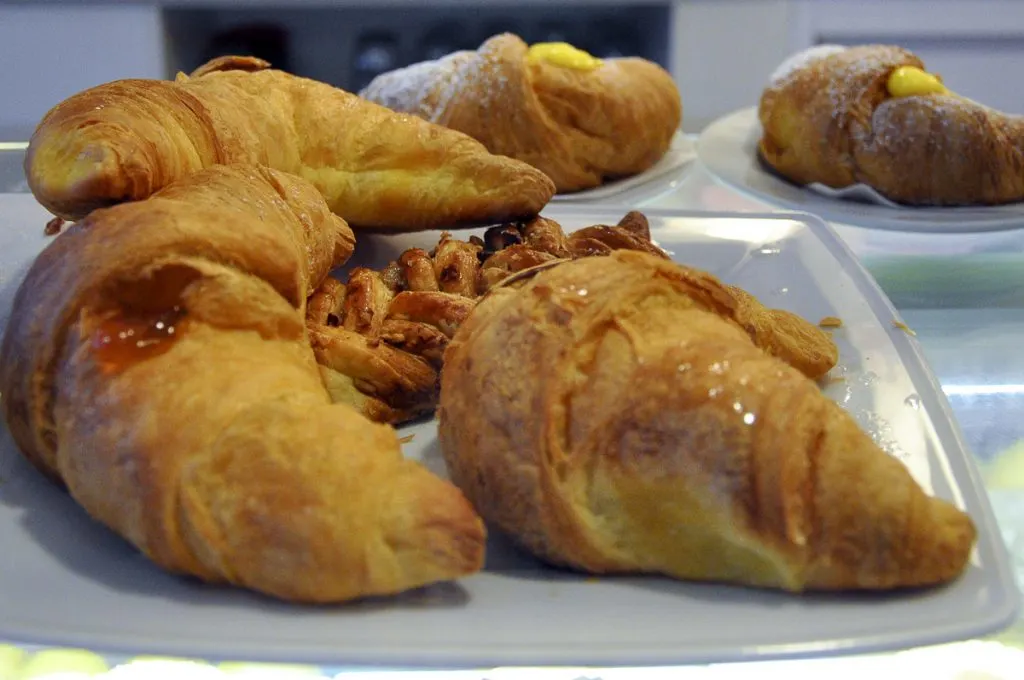 A plate with different types of brioche and breakfast pastries - Treviso, Italy - rossiwrites.com
