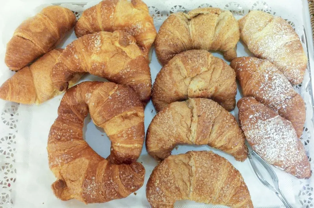 A tray of brioches with different fillings served for breakfast in Italy - rossiwrites.com