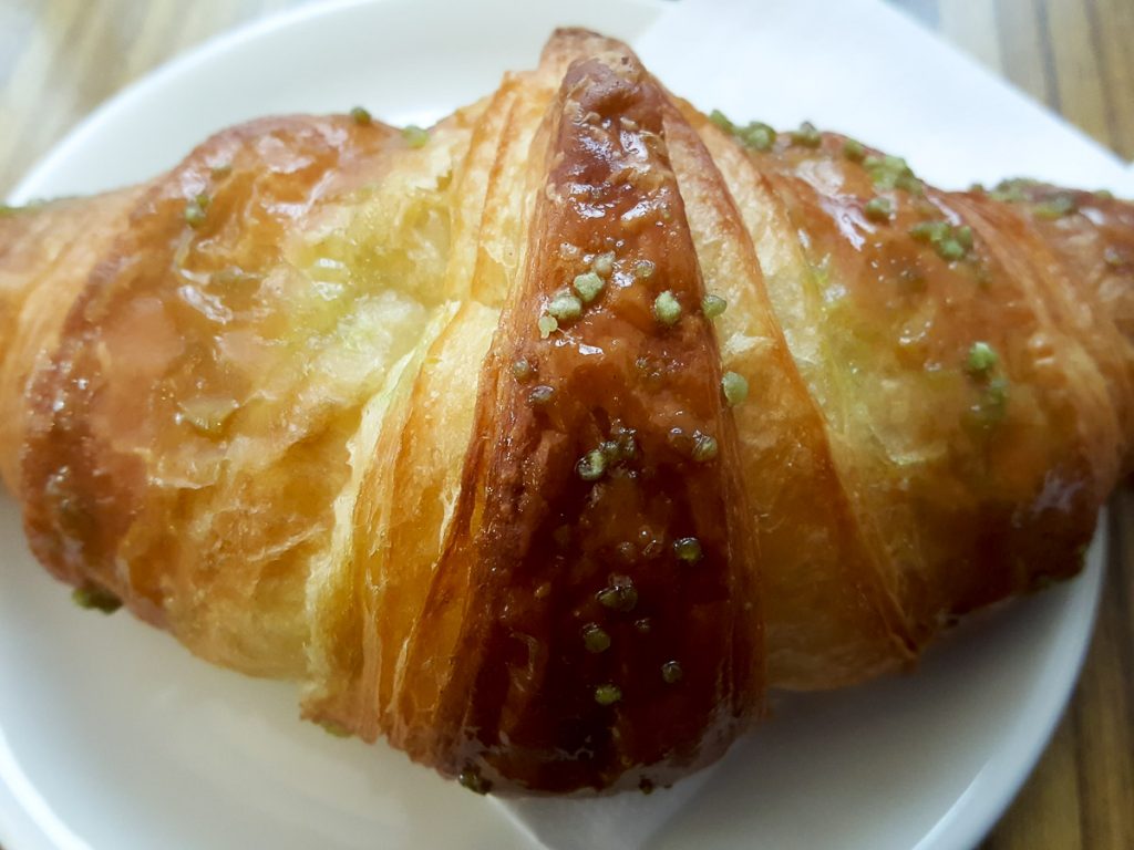 Close-up of a brioche with pistacchio spread - Vicenza, Italy - rossiwrites.com