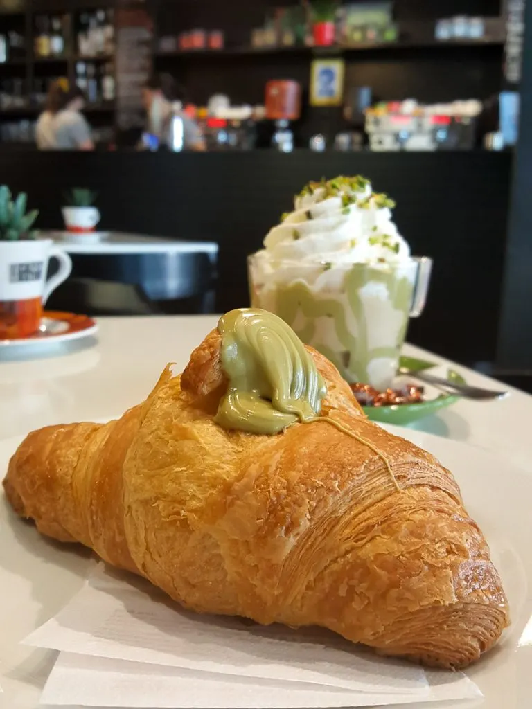 Large brioche with pistacchio spread served in a local caffe - Padua, Italy - rossiwrites.com