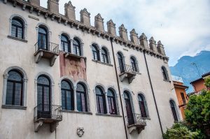 Palazzo dei Capitani with a view of Monte Baldo behind it - Malcesine, Italy - rossiwrites.com