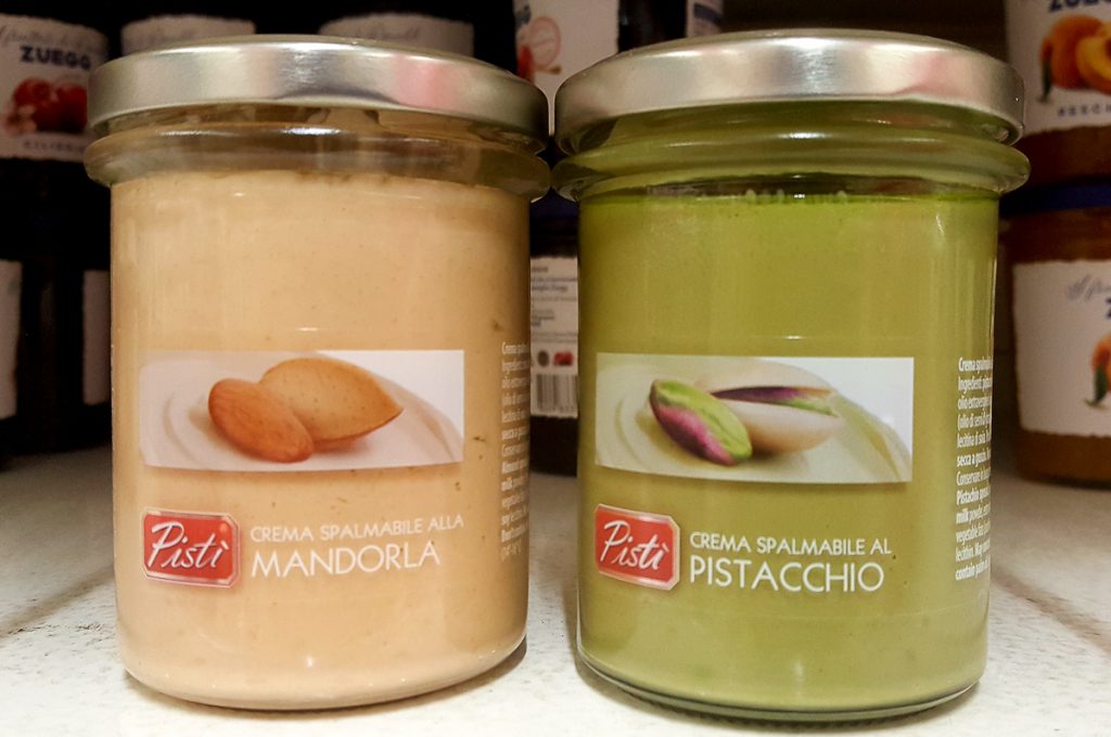 Jars with an almond spread and a pistacchio spread in a local supermarket - Vicenza, Italy - rossiwrites.com