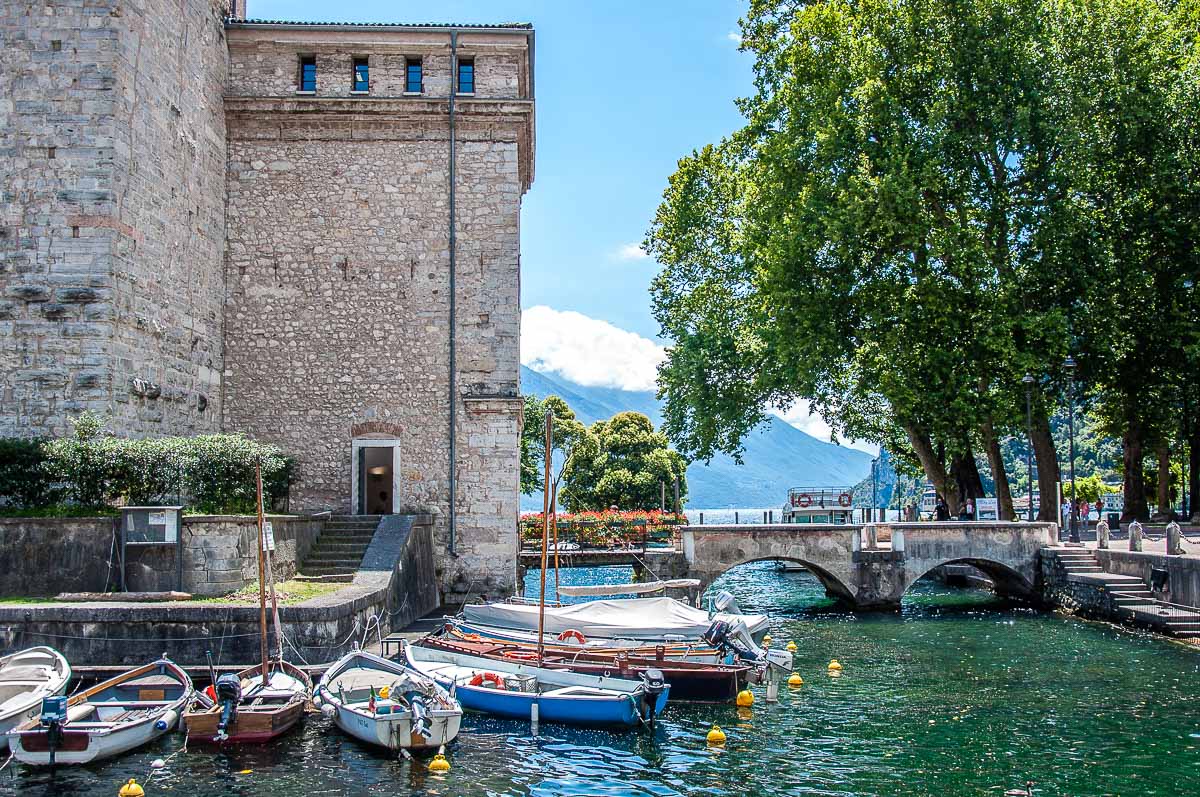 The fortress Rocca di Garda with boats and views of Lake Garda - Riva del Garda, Italy - rossiwrites.com