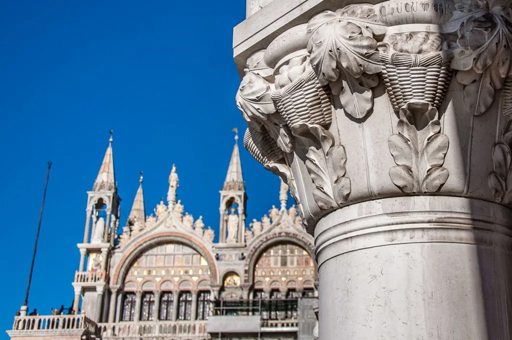 The facade of St. Mark's Basilica and a close-up of a capital of the Doge's Palace - Venice, Italy - rossiwrites.com