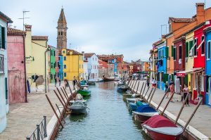 Colourful houses flanking a canal with boats - Burano - Venice, Italy - rossiwrites.com