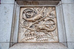 Panel with a bas-relief on the stone pillars of the fence - Natural History Museum, London, England - rossiwrites.com