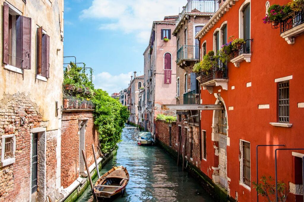 View of a small side canal with a boat - Venice, Italy - rossiwrites.com