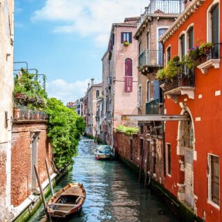 View of a small side canal with a boat - Venice, Italy - rossiwrites.com