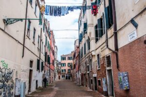 View of a small Venetian corte with clothes drying on the line above it - Venice, Italy - rossiwrites.com