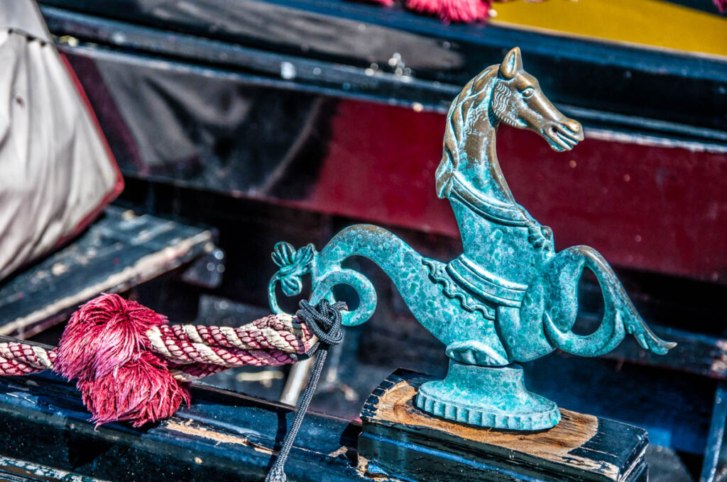 Traditional hippocampus figurine decorating a gondola - Venice, Italy - rossiwrites.com