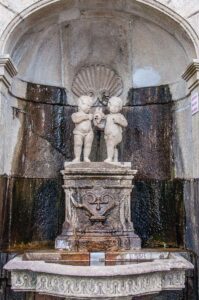 A fountain on the Stairway of the Three Virtues leading to the Sanctuary of Bom Jesus do Monte - Braga, Portugal - rossiwrites.com
