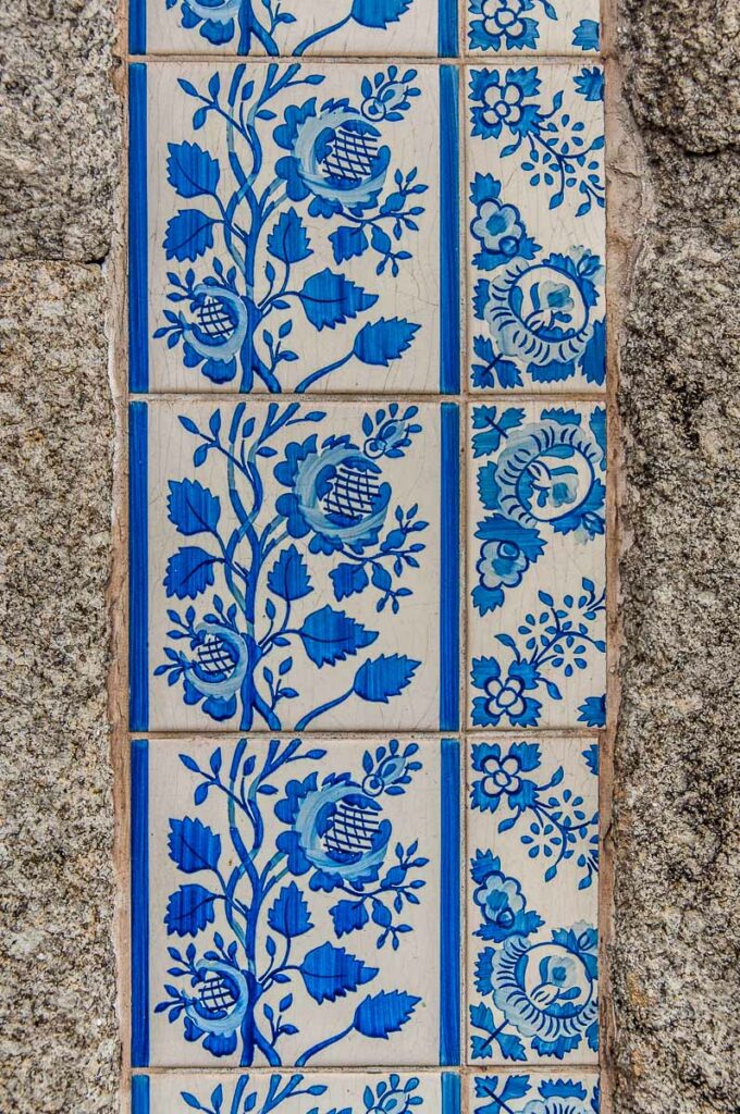 A strip of azulejos decorates the walls of an old house - Porto, Portugal - rossiwrites.com