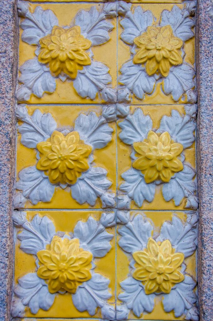 Azulejos decorating the facade of a building - Porto, Portugal - rossiwrites.com