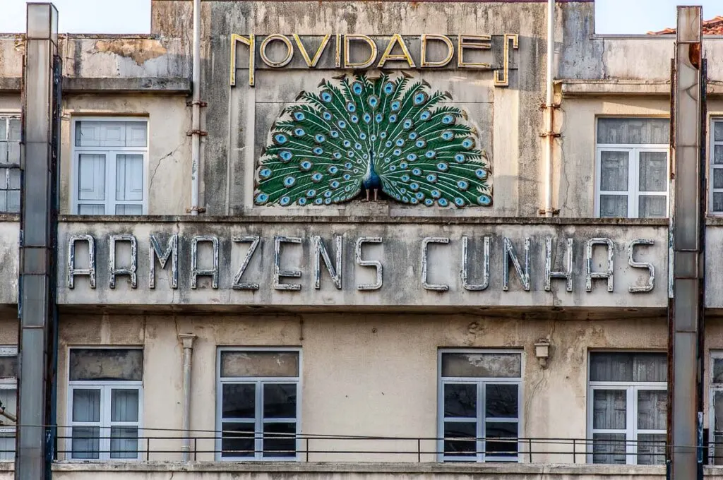 Historic facade decorated with a large peacock - Porto, Portugal - rossiwrites.com