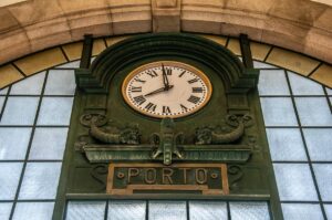 The clock in the Sao Bento train station - Porto, Portugal - rossiwrites.com