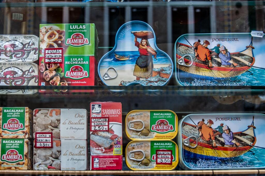 Tinned fish on the window display of the historic deli A Perola do Bolhao - Porto, Portugal - rossiwrites.com