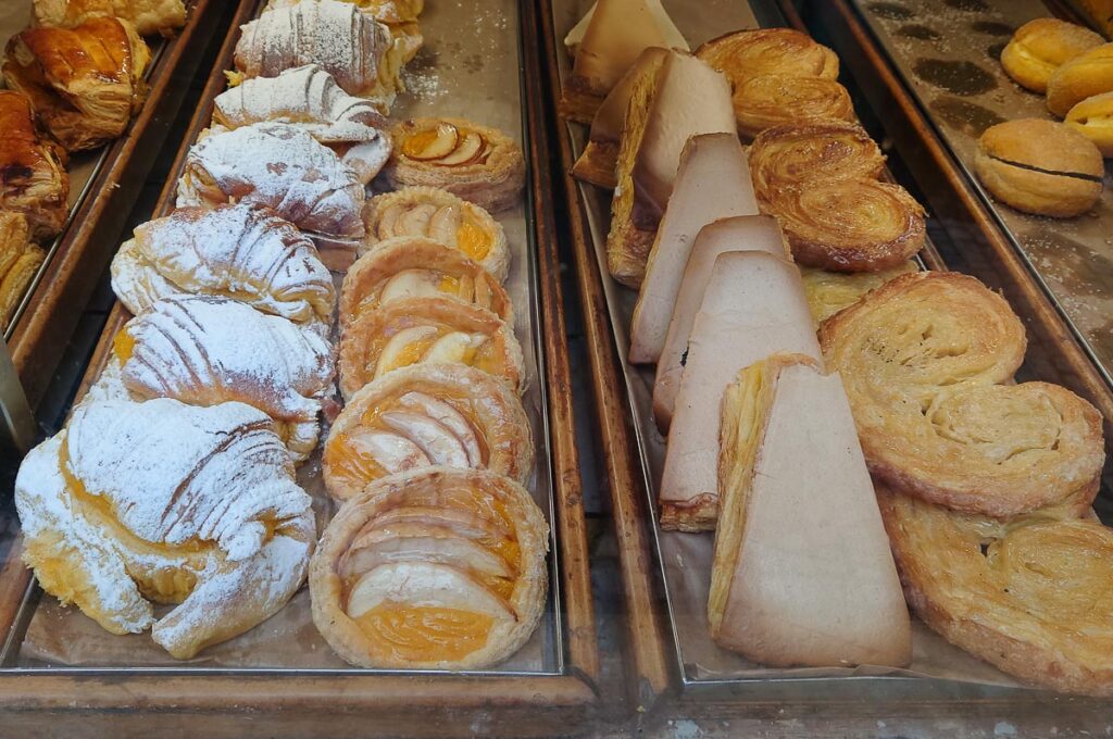 Traditional pastries in the window display of a local patisserie - Porto, Portugal - rossiwrites.com