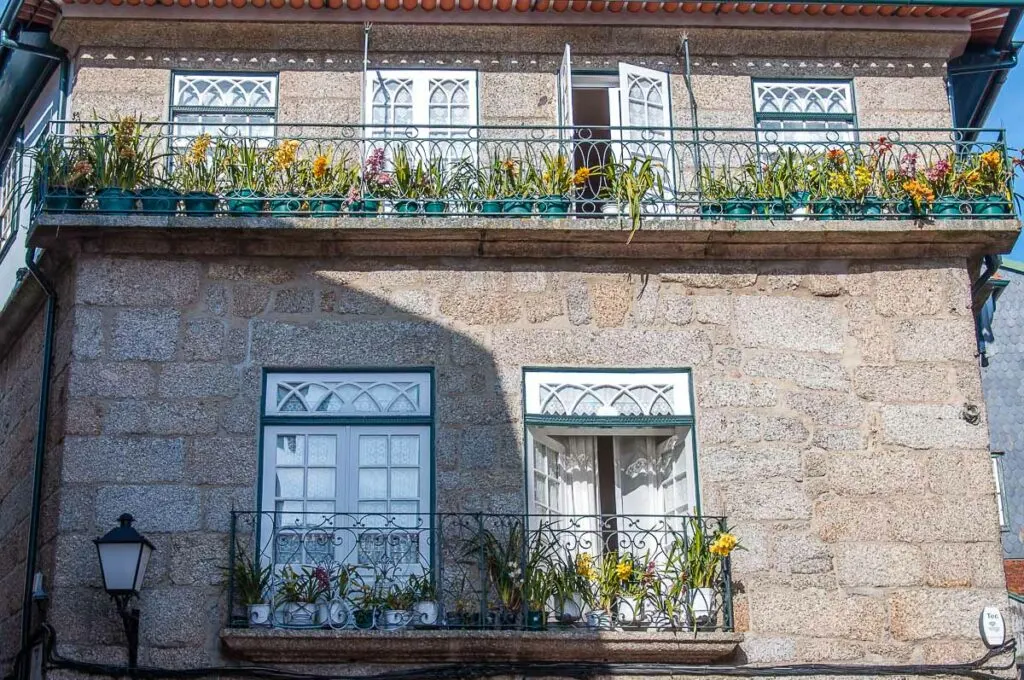 Balconies with blooming orchids - Guimaraes, Portugal - rossiwrites.com