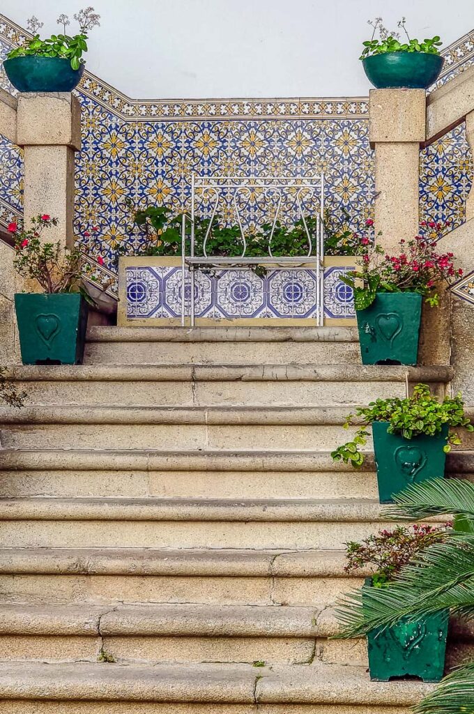 Private courtyard with a stone staircase decorated with azulejos - Guimaraes, Portugal - rossiwrites.com