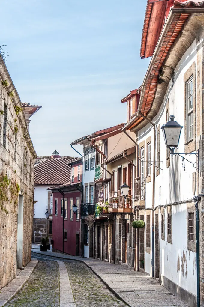Small historic street leading into the Largo dos Laranjais - Guimaraes, Portugal - rossiwrites.com