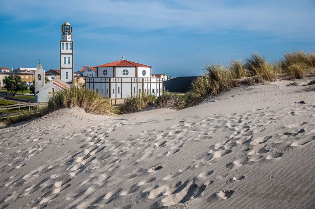 The Igreja Matriz de Costa Nova with the sand dunes - Costa Nova, Aveiro, Portugal - rossiwrites.com
