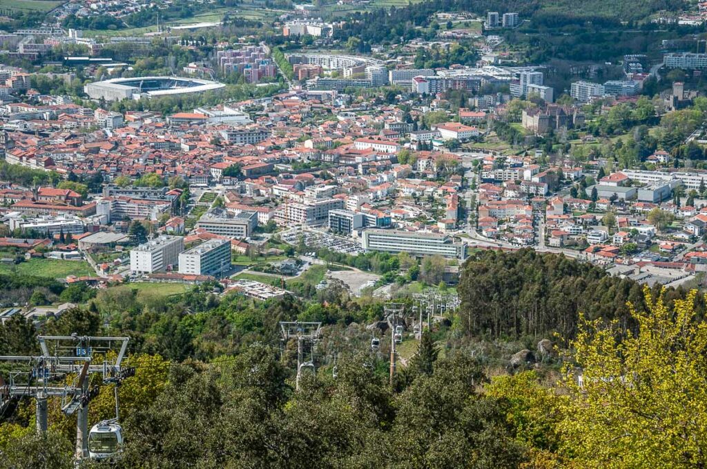The town and the cable car seen from the top of Monte da Penha - Guimaraes, Portugal - rossiwrites.com